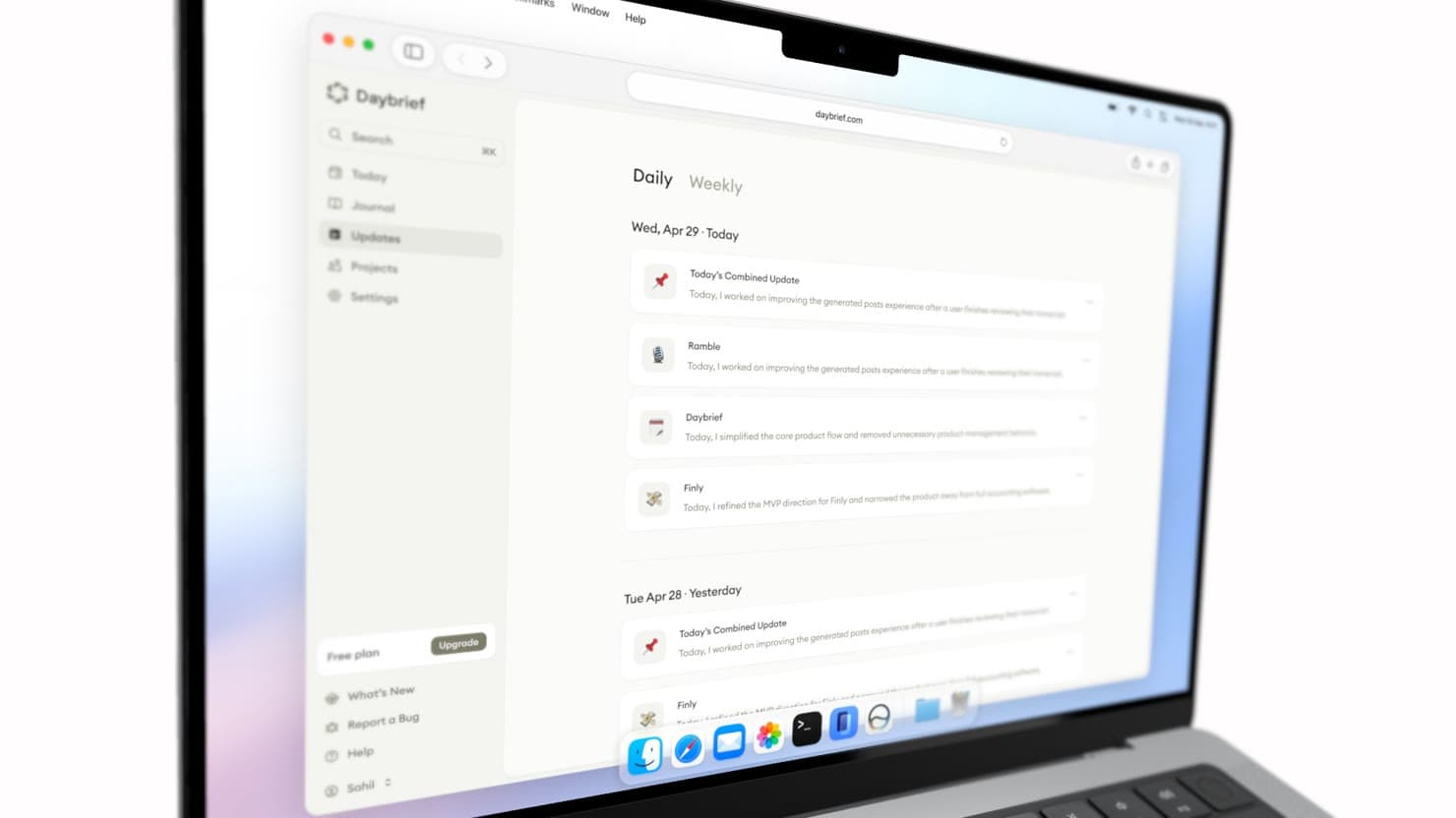 A MacBook mockup showing a web page in a browser window, with the macOS menu bar across the top and a glass Dock at the bottom.